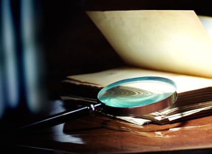Magnifying glass and documents